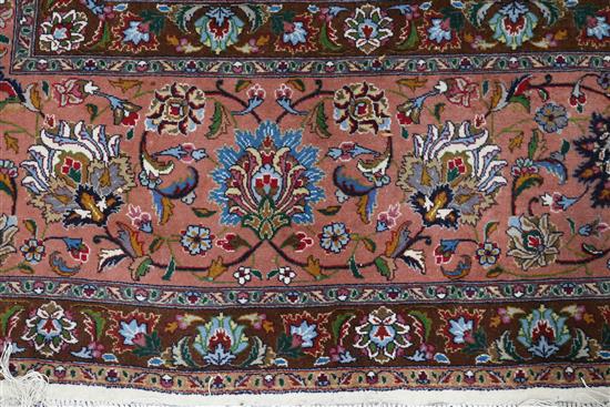 A Tabriz cream ground medallion carpet 400 x 305cm